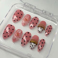 Full set of press-on nails with polka dots, bangle nail art, and 3d flowers
